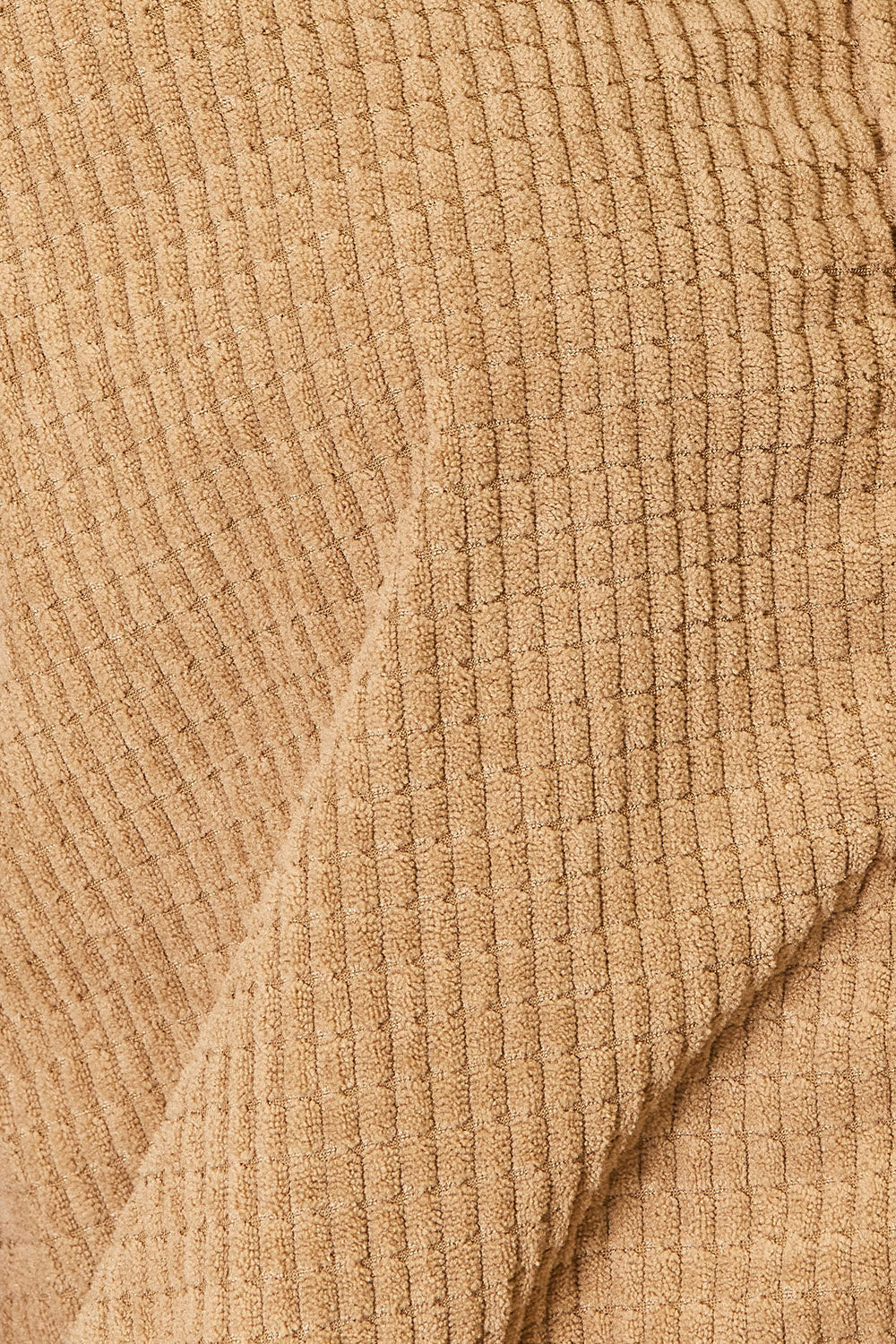 Close-up of the camel jacket's raised grid-textured fabric
