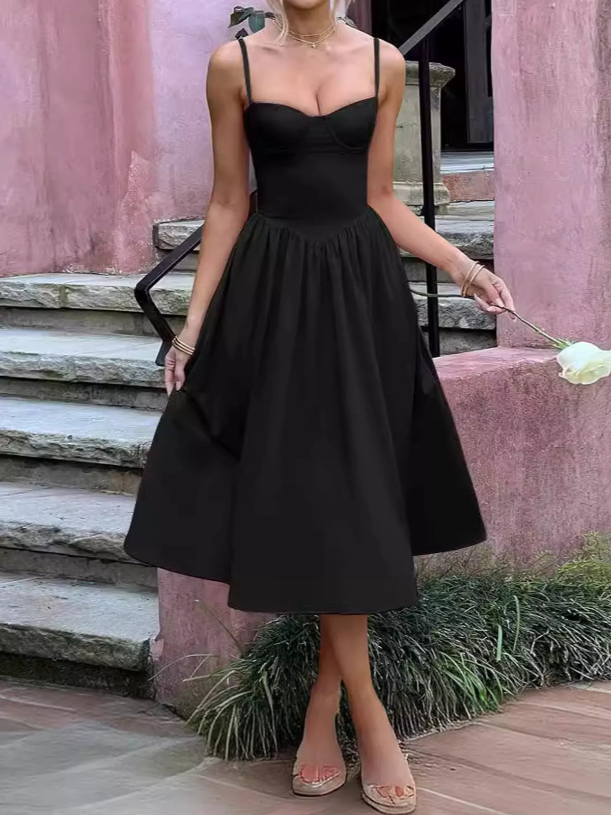 Black sweetheart-neck midi dress with spaghetti straps and full gathered skirt, front view