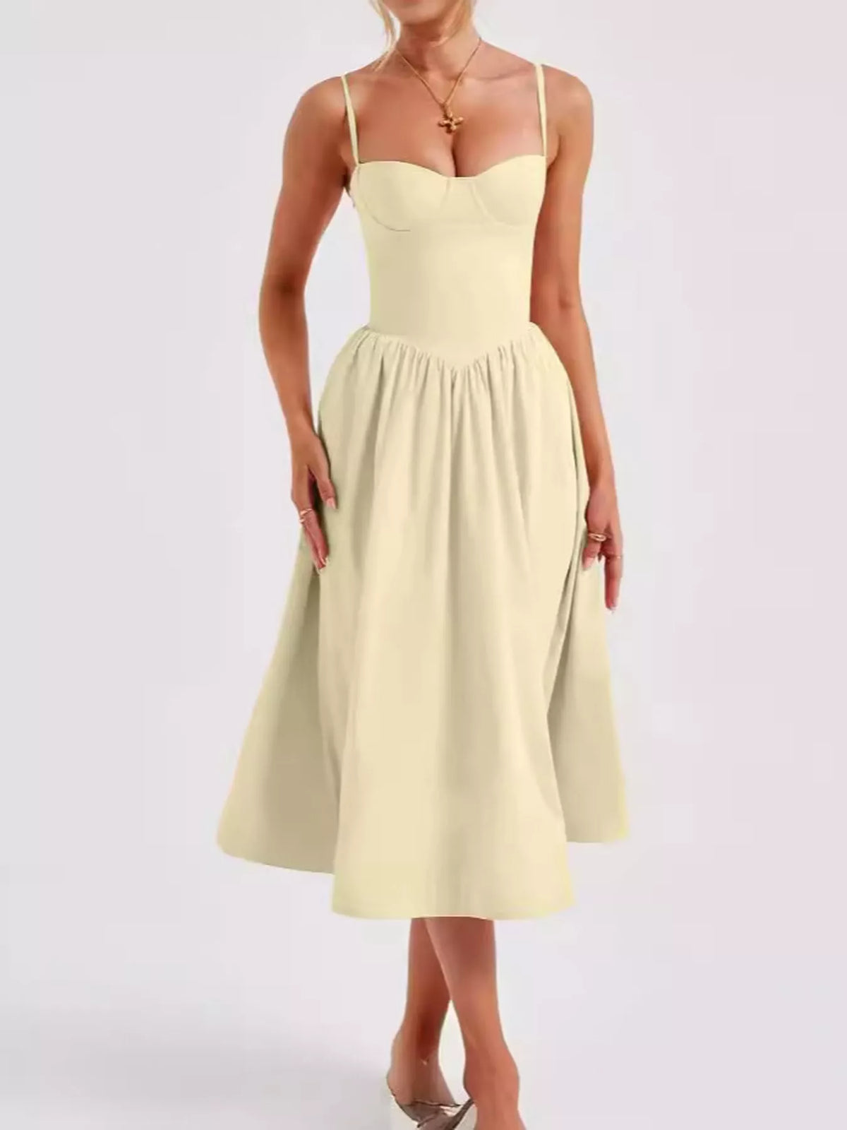 Light Yellow (a pale, buttery yellow) sweetheart-neck midi dress with spaghetti straps, front view