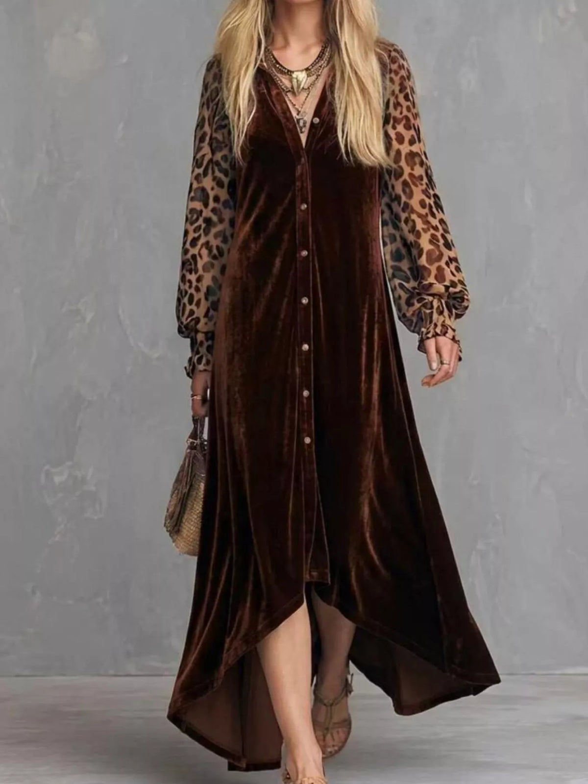 Woman wearing a brown velvet button-front maxi dress with leopard print sleeves, full-length front view