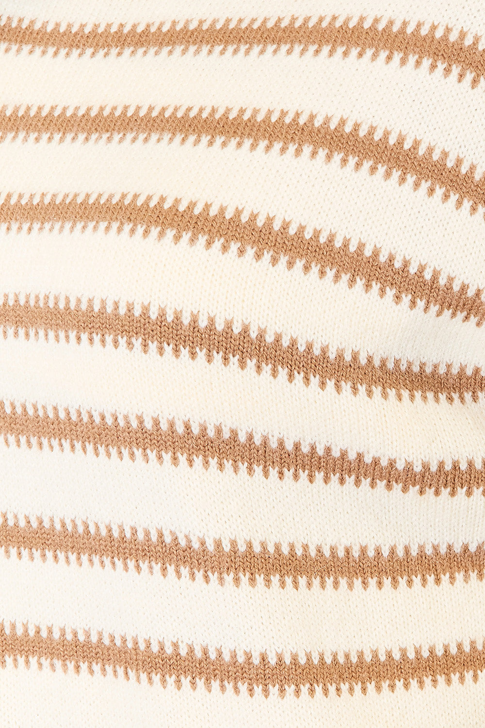 Close-up of the cream knit with camel stripes and stitched zigzag edges