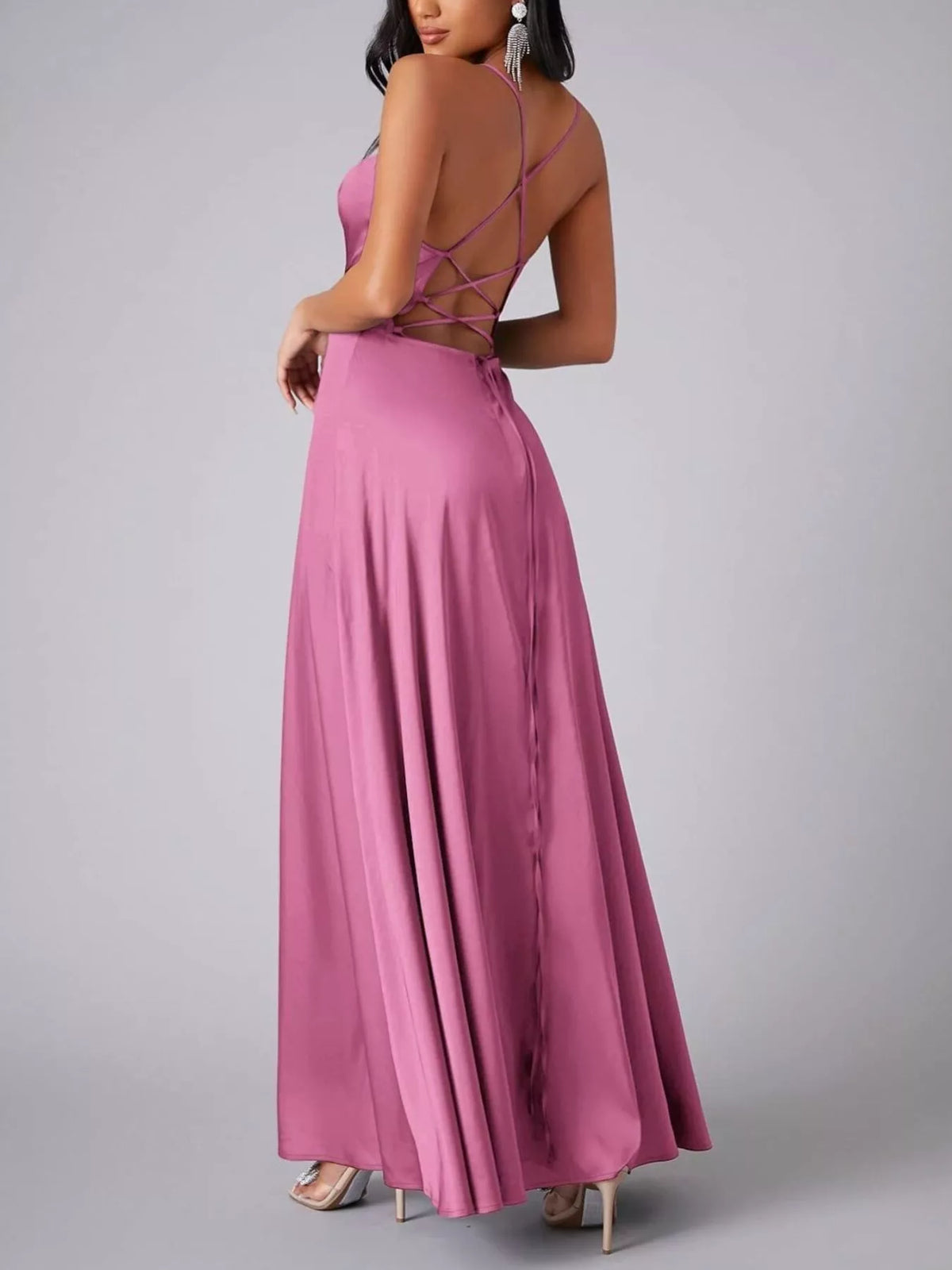 Pink glossy cowl-neck maxi dress with crisscross lace-up back, back three-quarter view