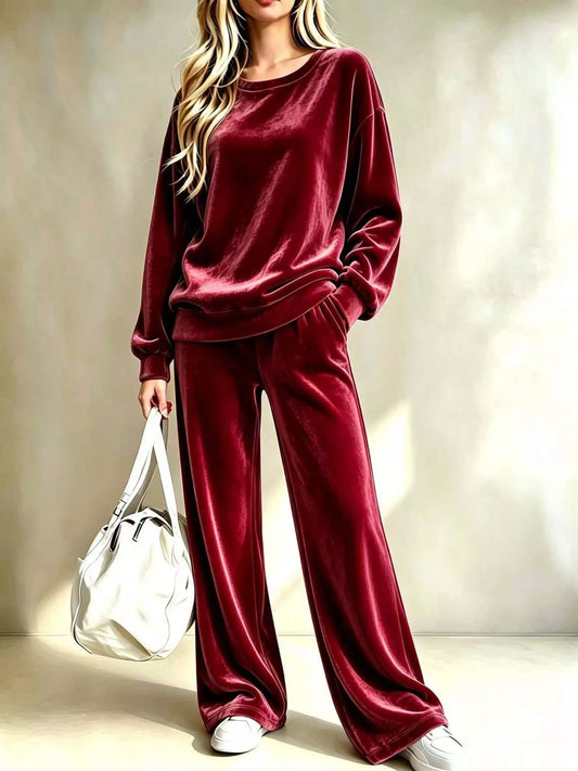 Burgundy velvet crew neck top with dropped shoulders and matching wide-leg pants, front view