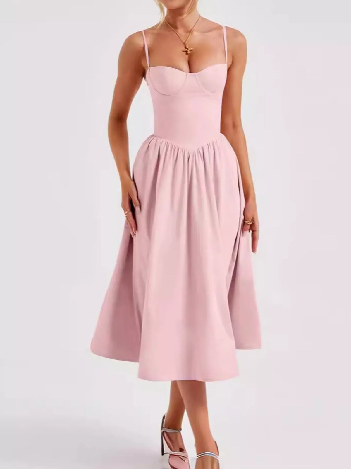 Pink (a light pink) sweetheart-neck midi dress with spaghetti straps and full skirt, front view
