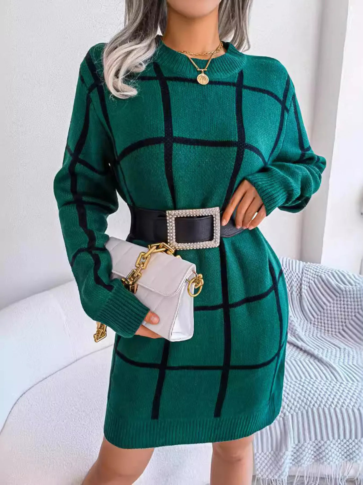 Black Forest green knit mini sweater dress with a black windowpane grid, styled with a black belt (belt not included), front view