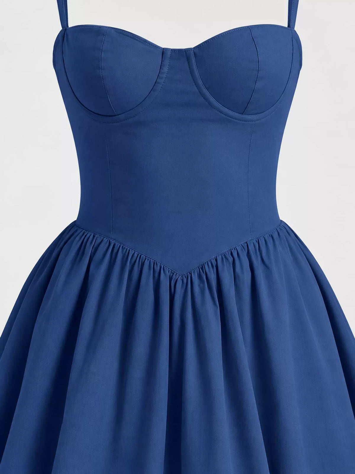 Close view of the Blue midi dress bodice: seamed cups, vertical seams and gathered V-shaped waist seam