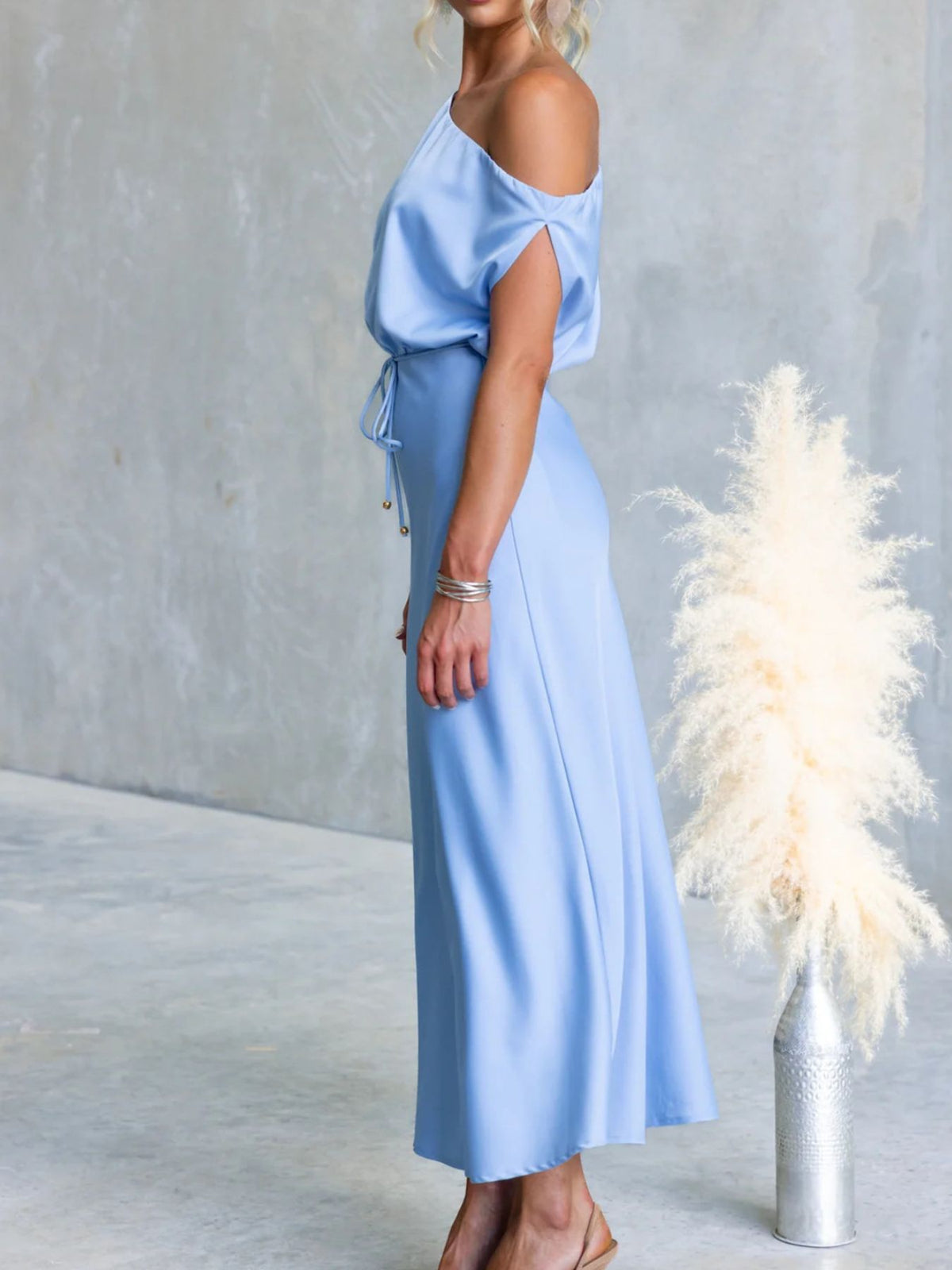 Side view of Light Blue one-shoulder maxi dress with draped sleeve