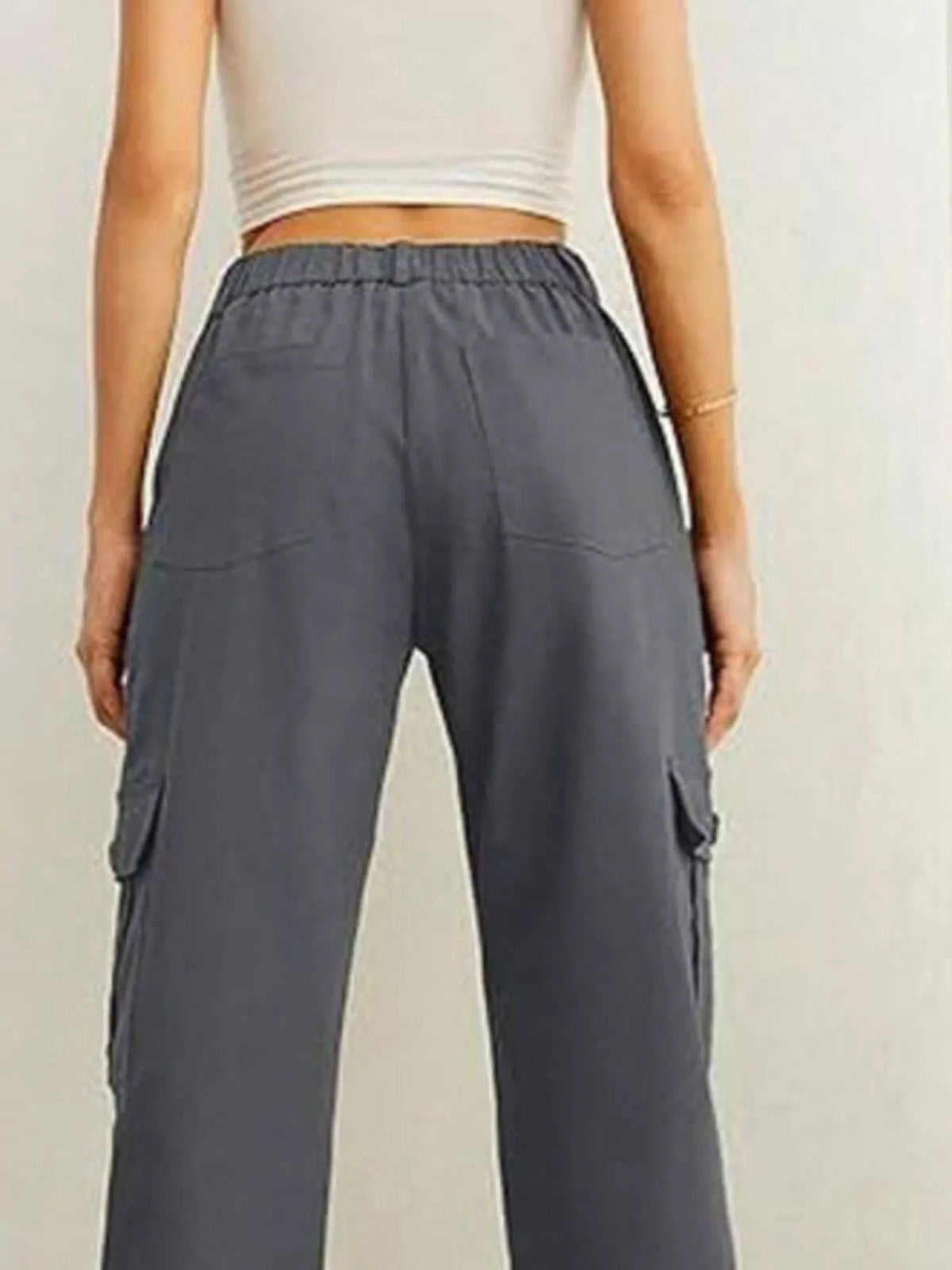 Dark grey cargo pants, back