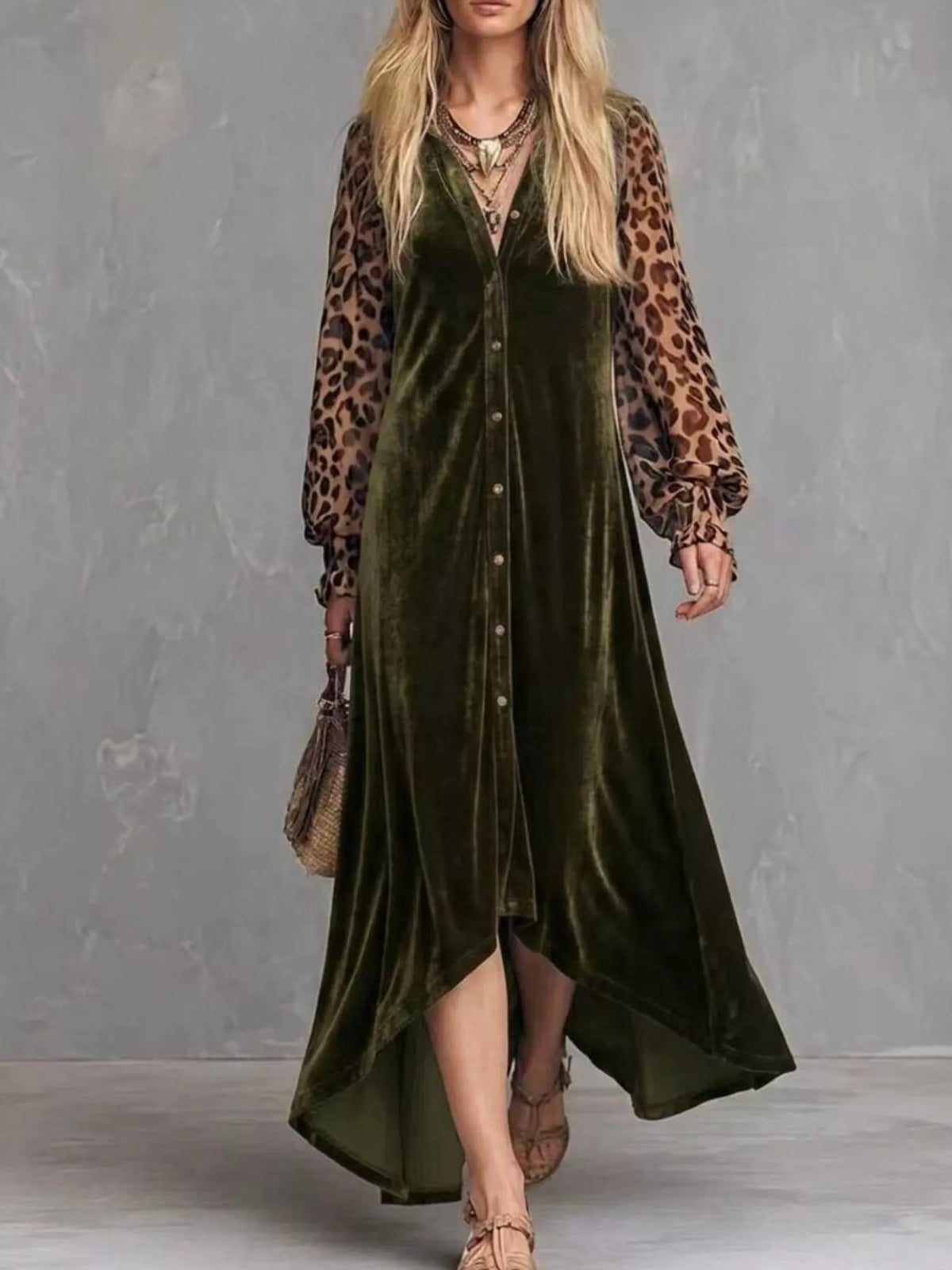Woman wearing an army green velvet button-front maxi dress with leopard print sleeves, full-length front view