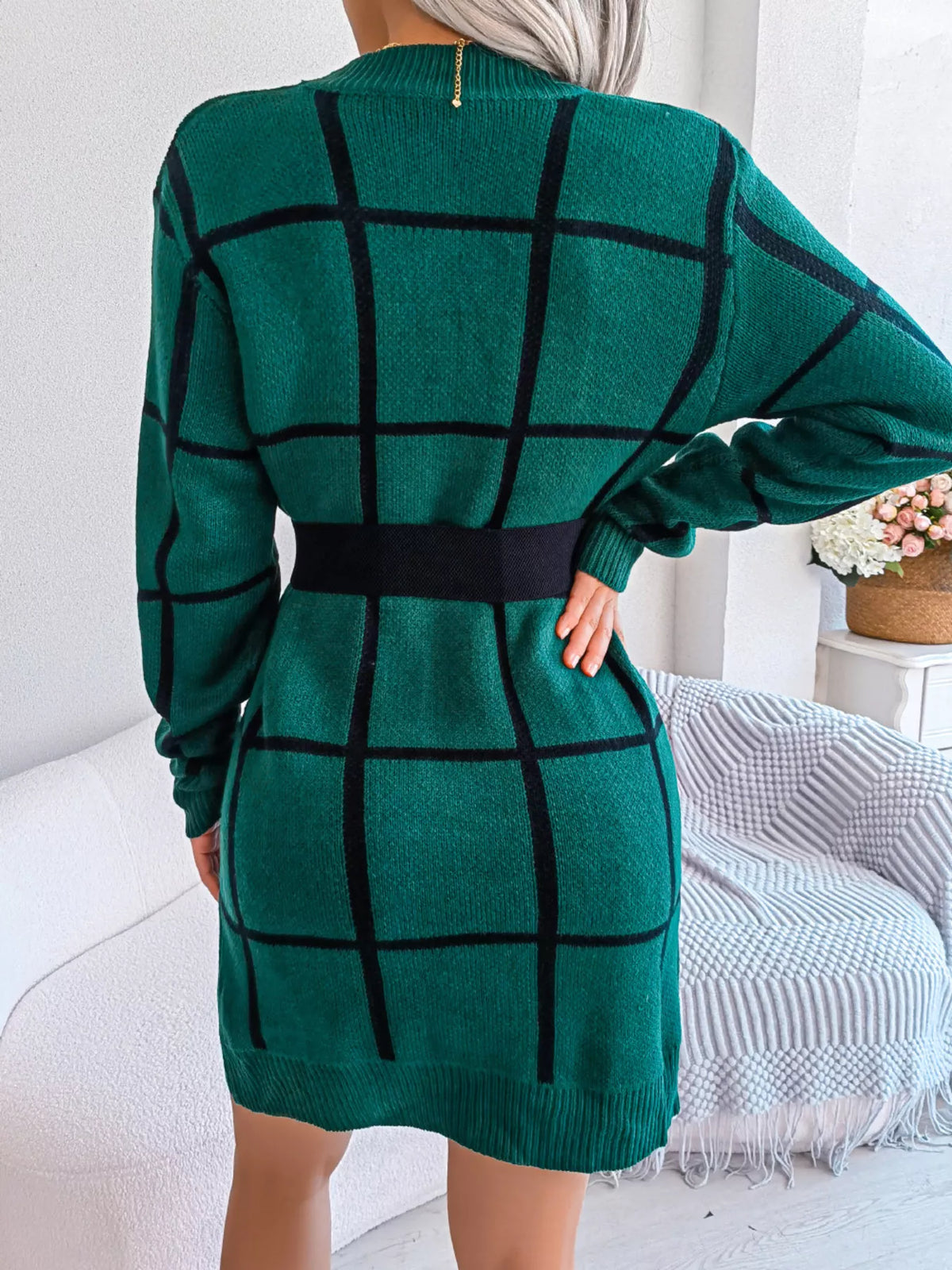 Back view of the Black Forest green knit sweater dress with a black windowpane grid pattern, styled with a black belt (belt not included)