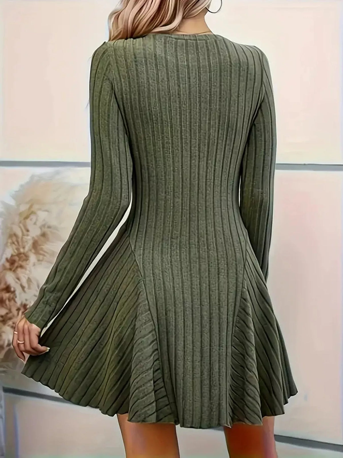 Back view of the Olive ribbed knit long-sleeve flared dress with panelled skirt and wavy hem