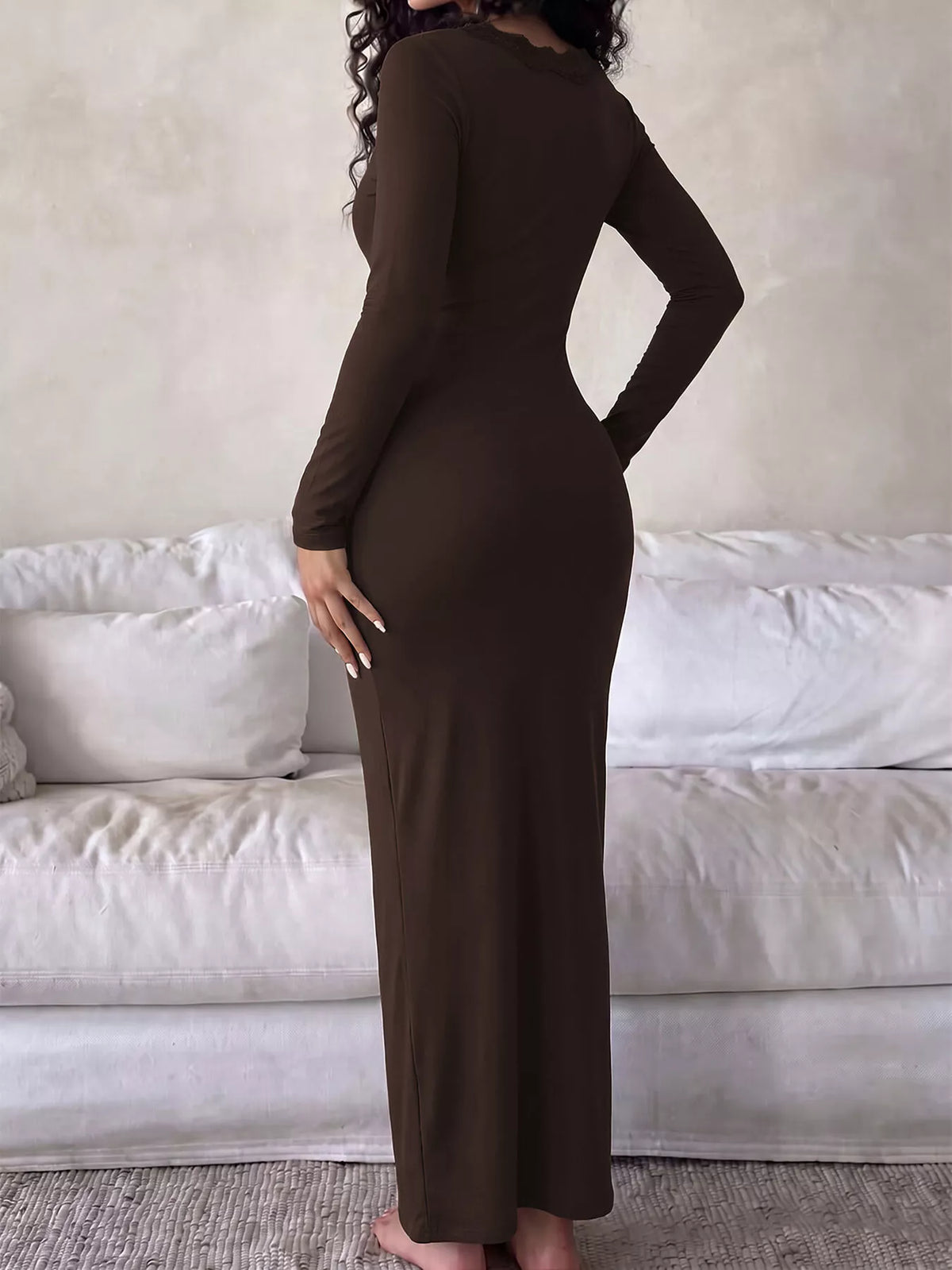 Back view of the Brown long-sleeve bodycon maxi dress with a flared hem