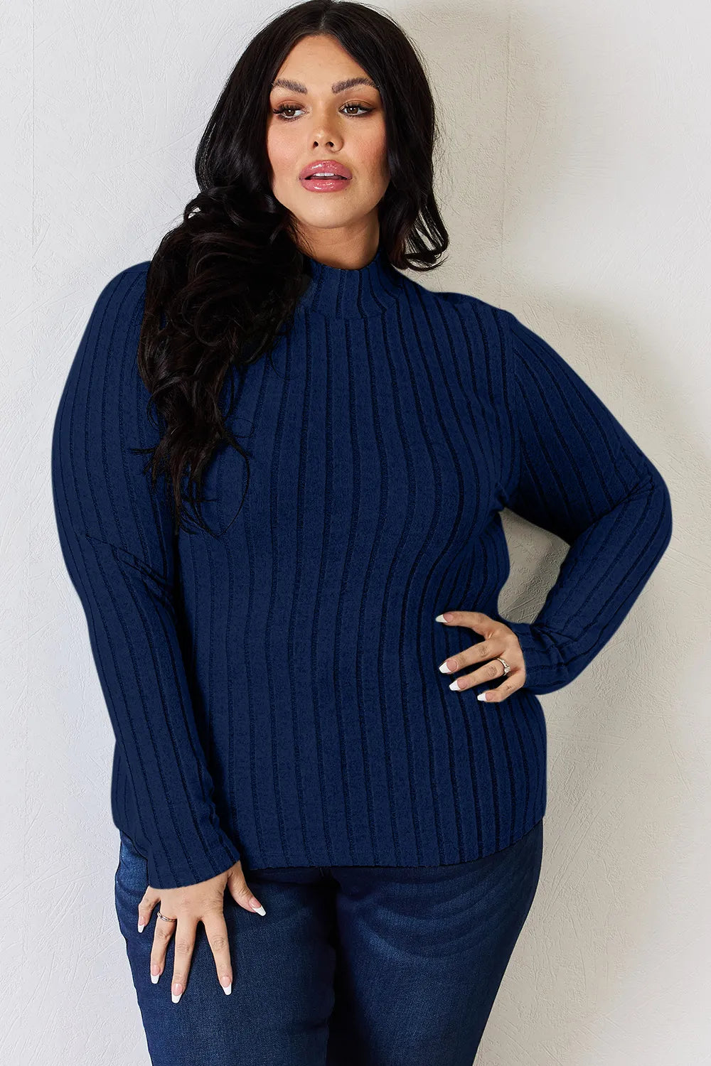 Ribbed mock neck long sleeve tee in Dark Blue, a deep navy, worn with dark jeans, front view