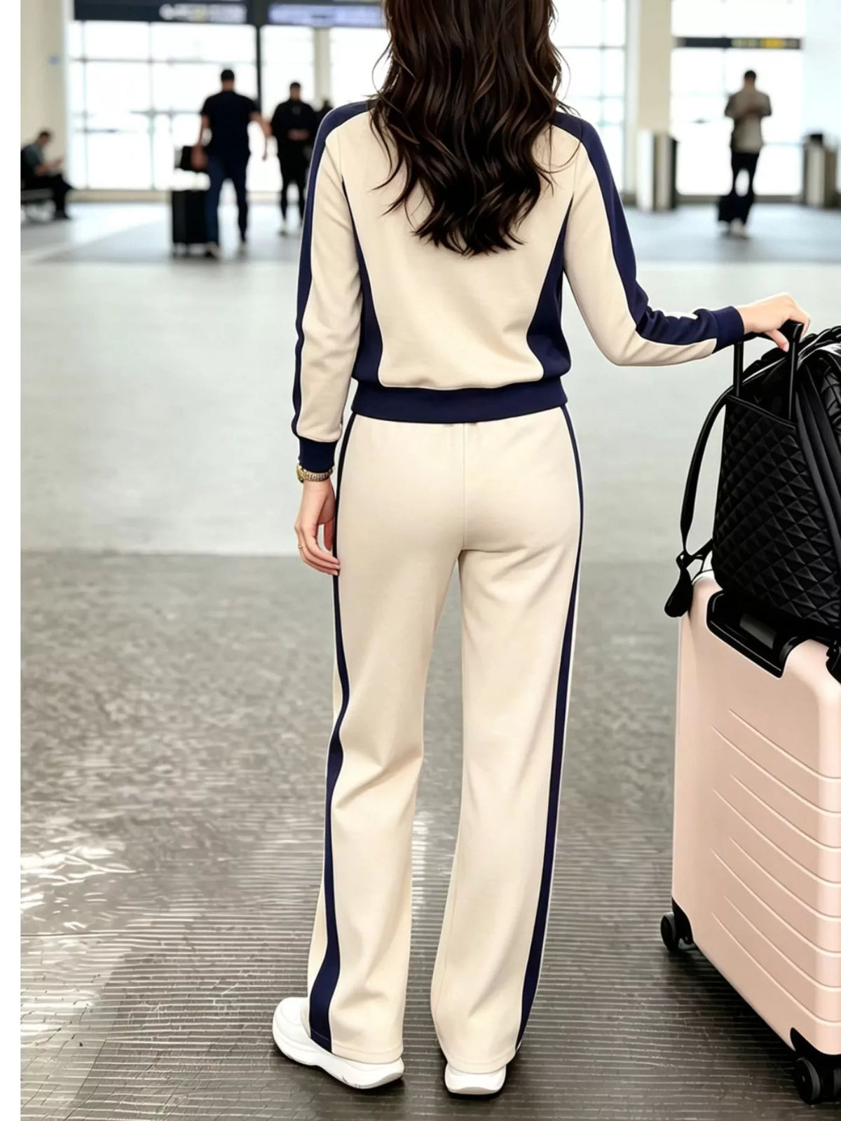 Back view of the Apricot top and pants set with navy side panels, cuffs and hem band, and navy stripes down the legs