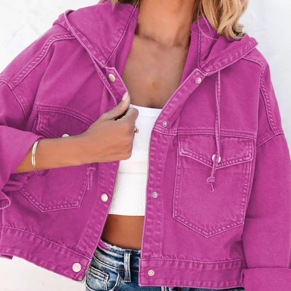 Close view of the fuchsia hooded denim jacket front, drawstring and chest pocket