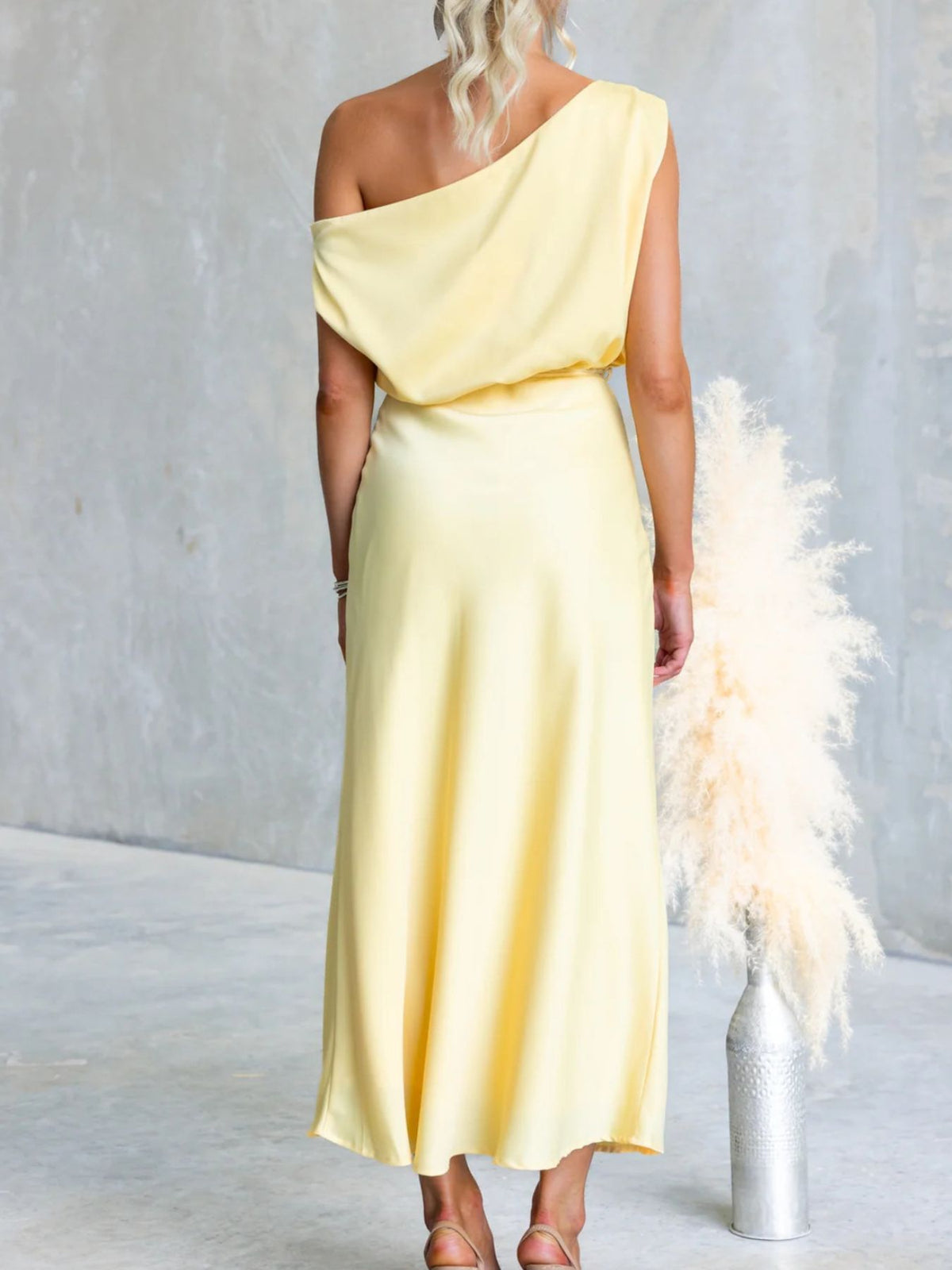 Back view of Yellow one-shoulder maxi dress