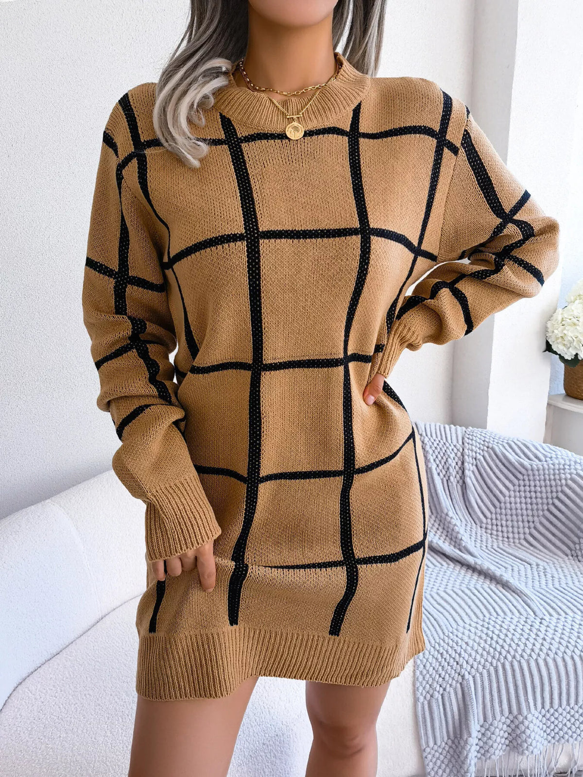 Camel long sleeve knit mini sweater dress with a black windowpane grid pattern, crew neck and ribbed hem, front view