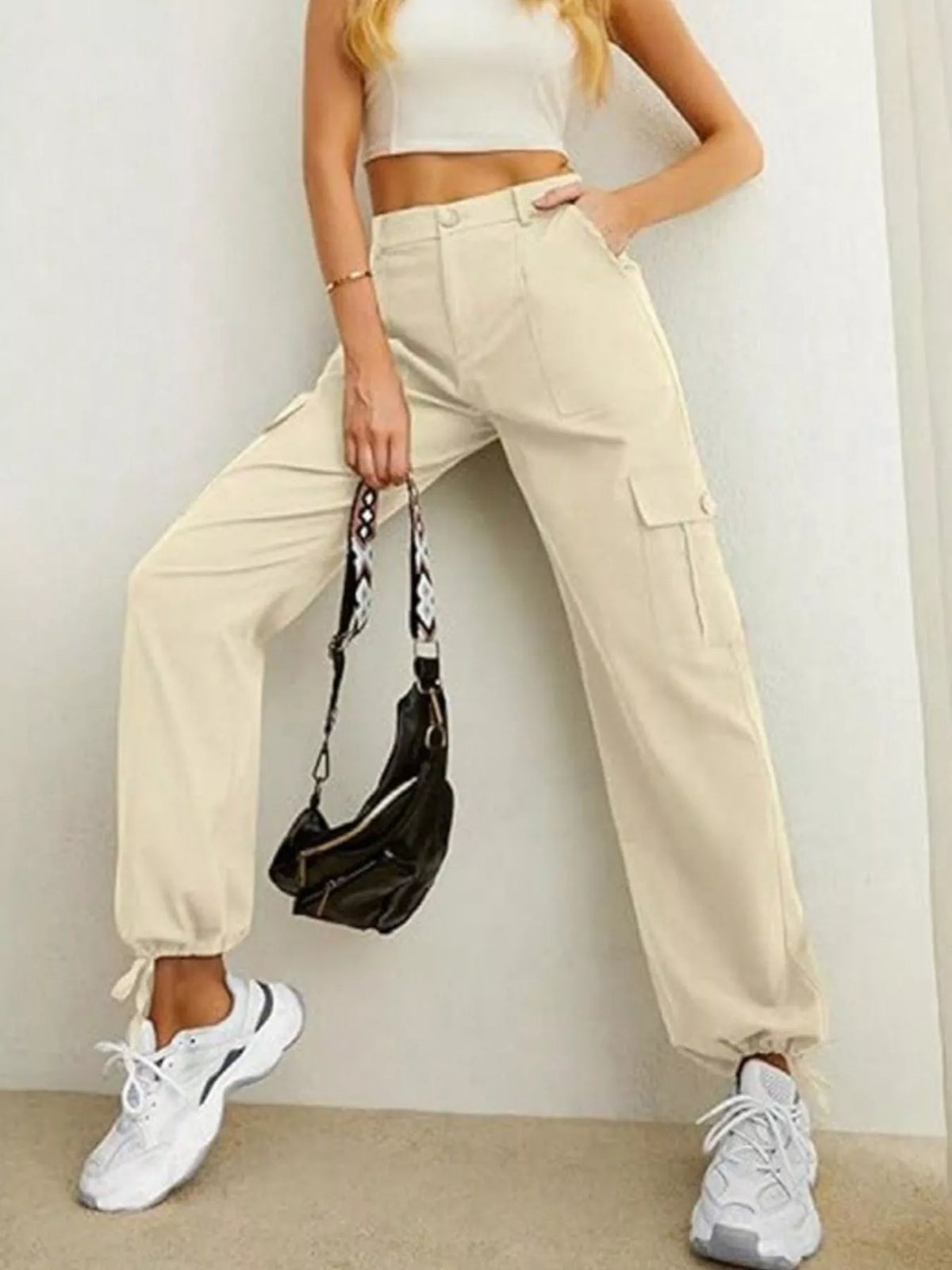 Apricot high-waist cargo pants with ankle drawstrings, front