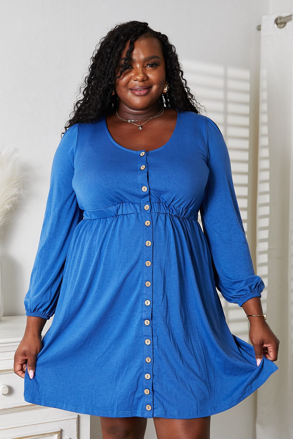 Royal Blue long sleeve empire waist dress with scoop neck and decorative buttons, front view