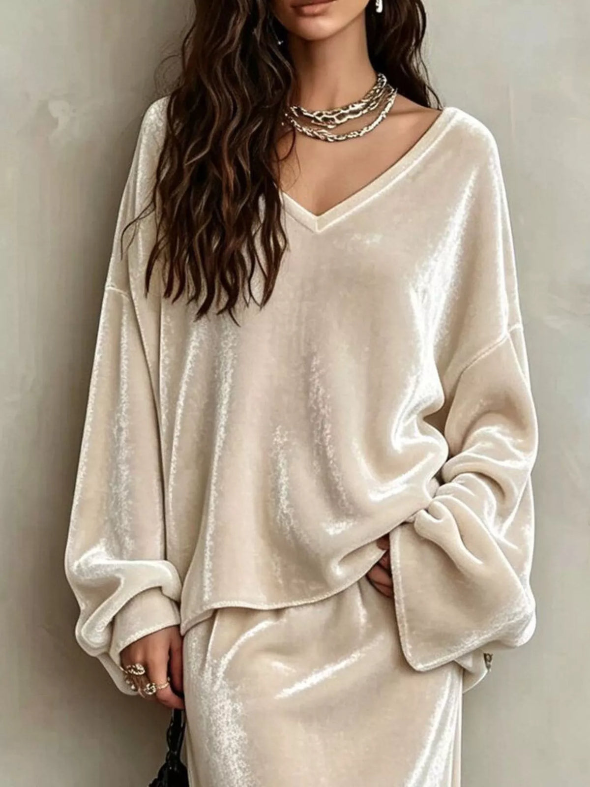 Close view of the Beige velvet V-neck top with dropped shoulders and long wide sleeves