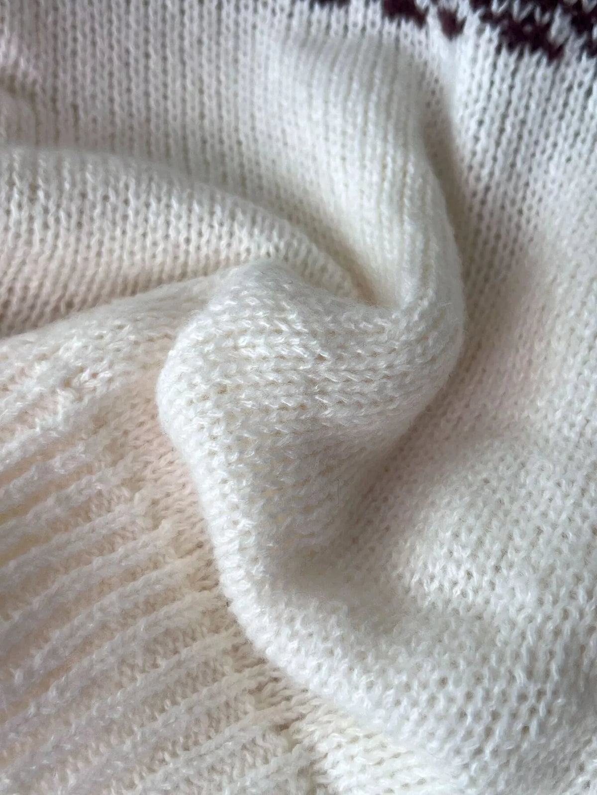 Close view of the cream knit and the ribbing of the fair isle sweater