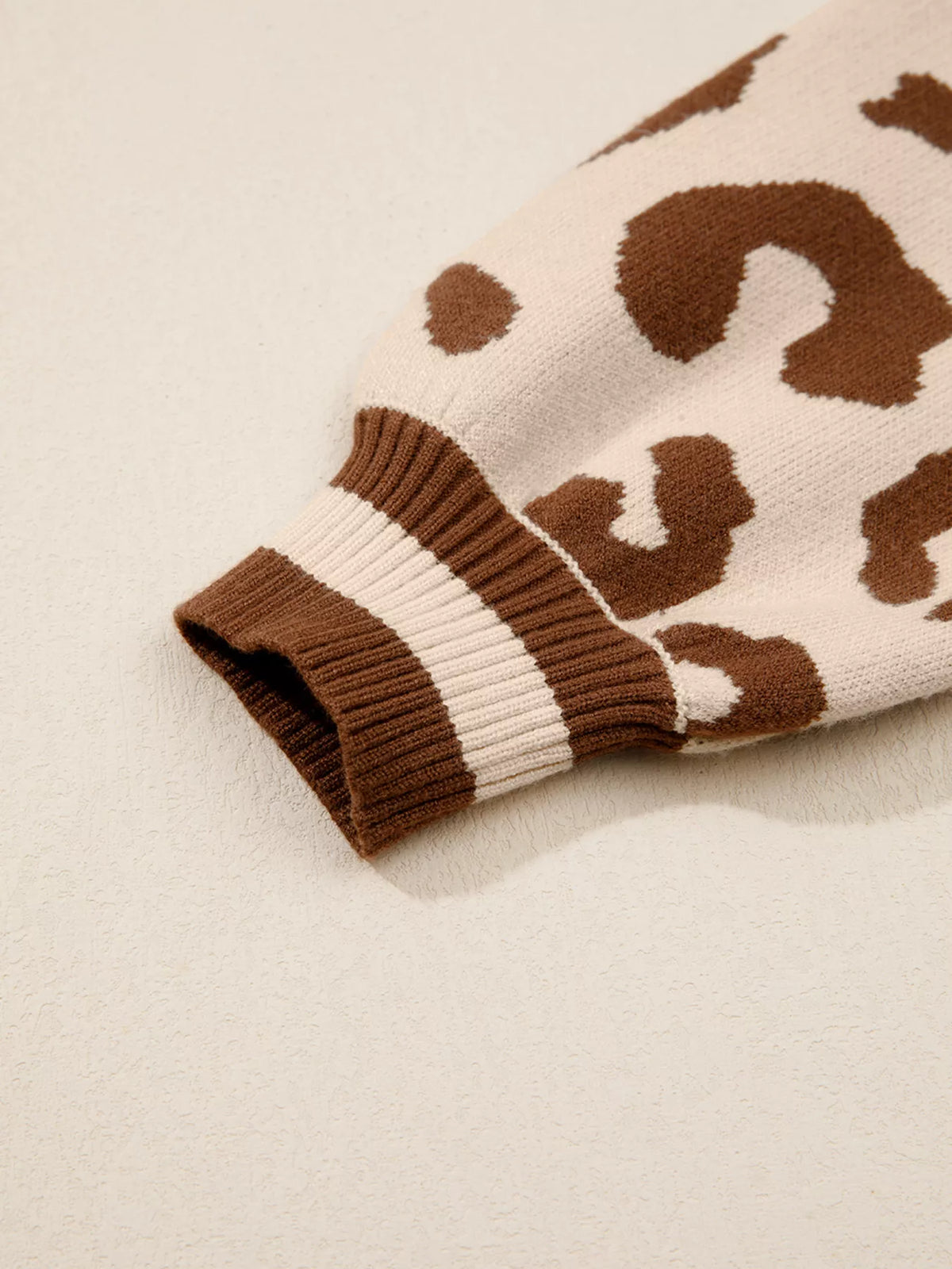 Close-up of the long sleeve gathered into a striped rib cuff