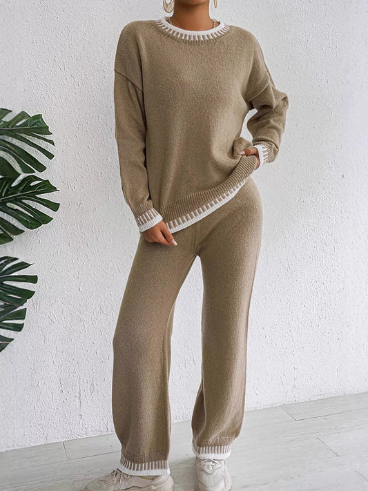 Taupe crew neck knit sweater and knit pants with white contrast stitching at the neckline, cuffs and hems, front view