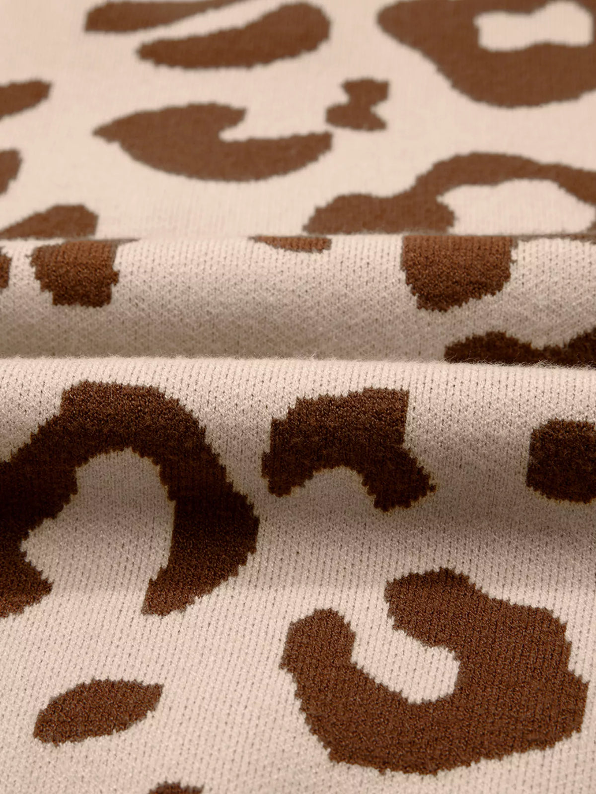 Close-up of the leopard pattern knit in brown and light sand