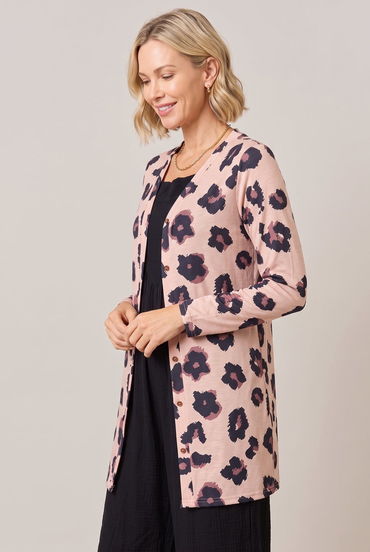 Side view of the leopard-print cardigan with button front
