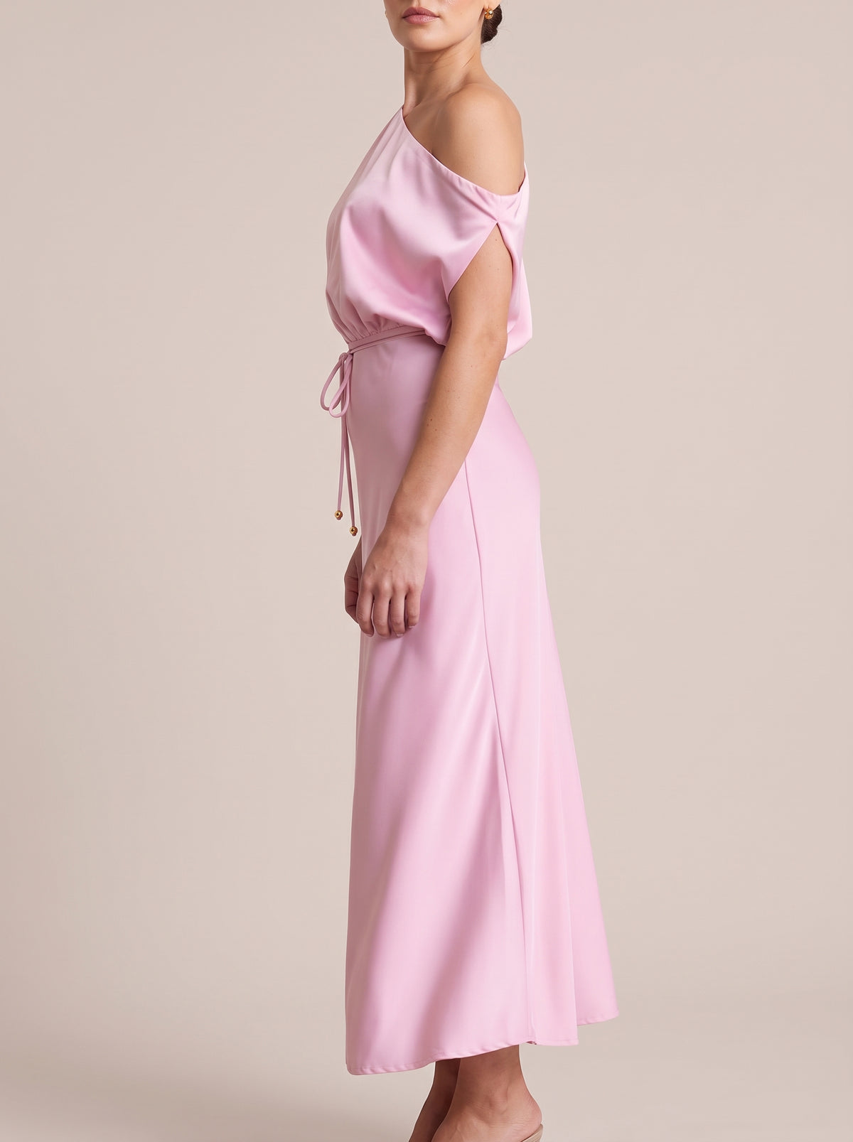 Side view of Pink one-shoulder maxi dress with draped sleeve