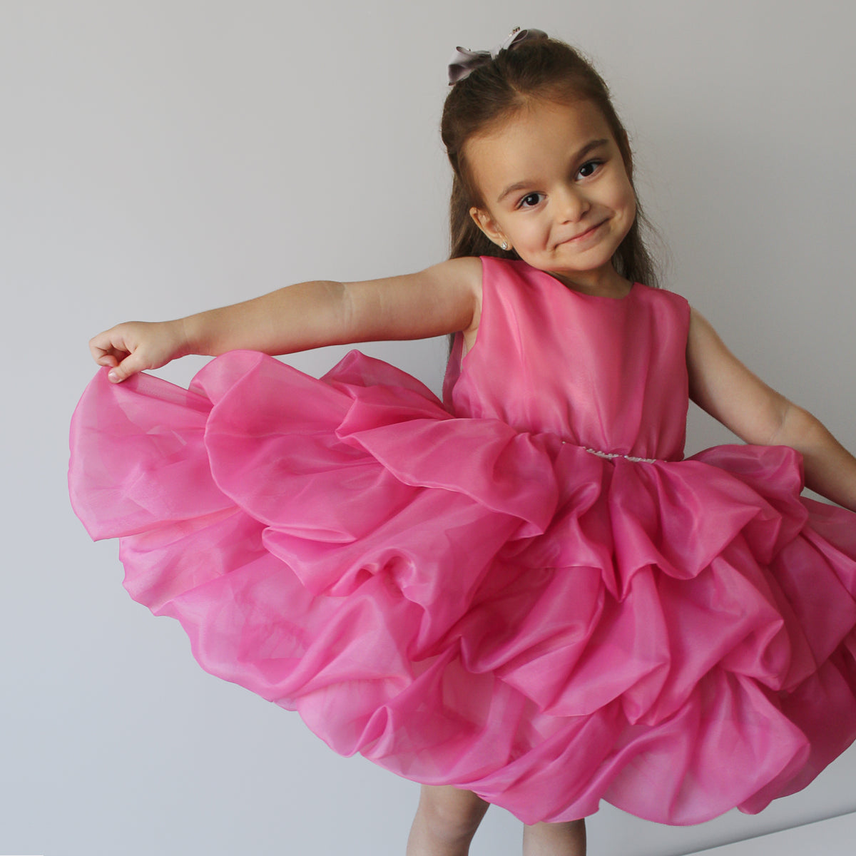 Melody pink ruffle dress with pearl waistband, front view