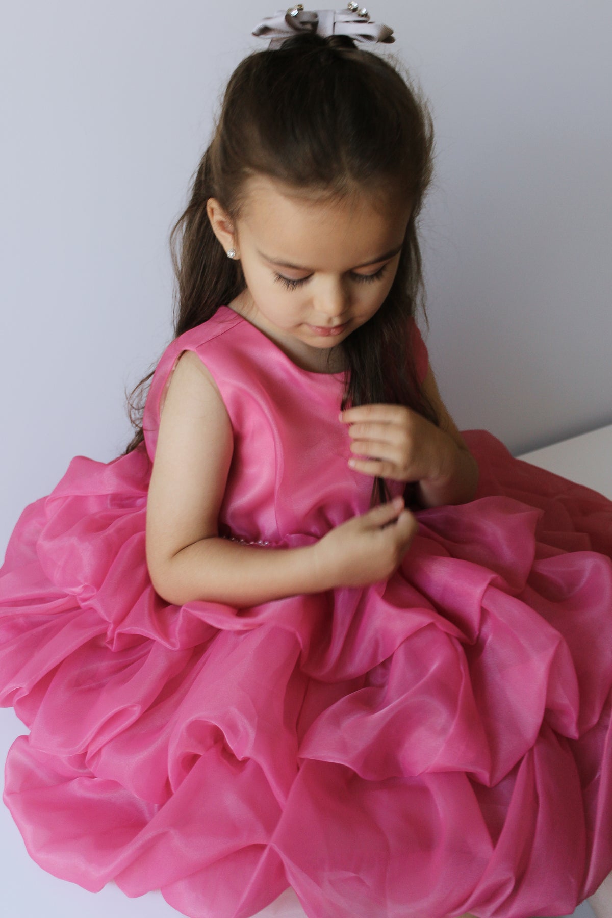 Pearl-like waistband detail on the Melody pink dress