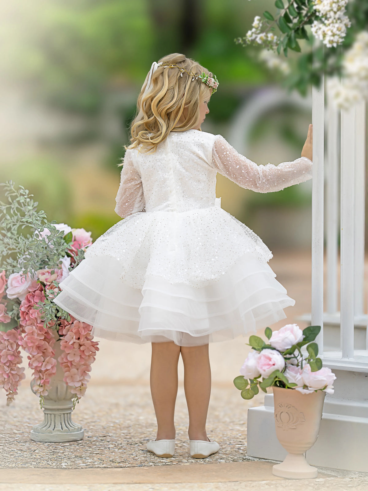 Statement bow at the waist of the Elsa sequin dress