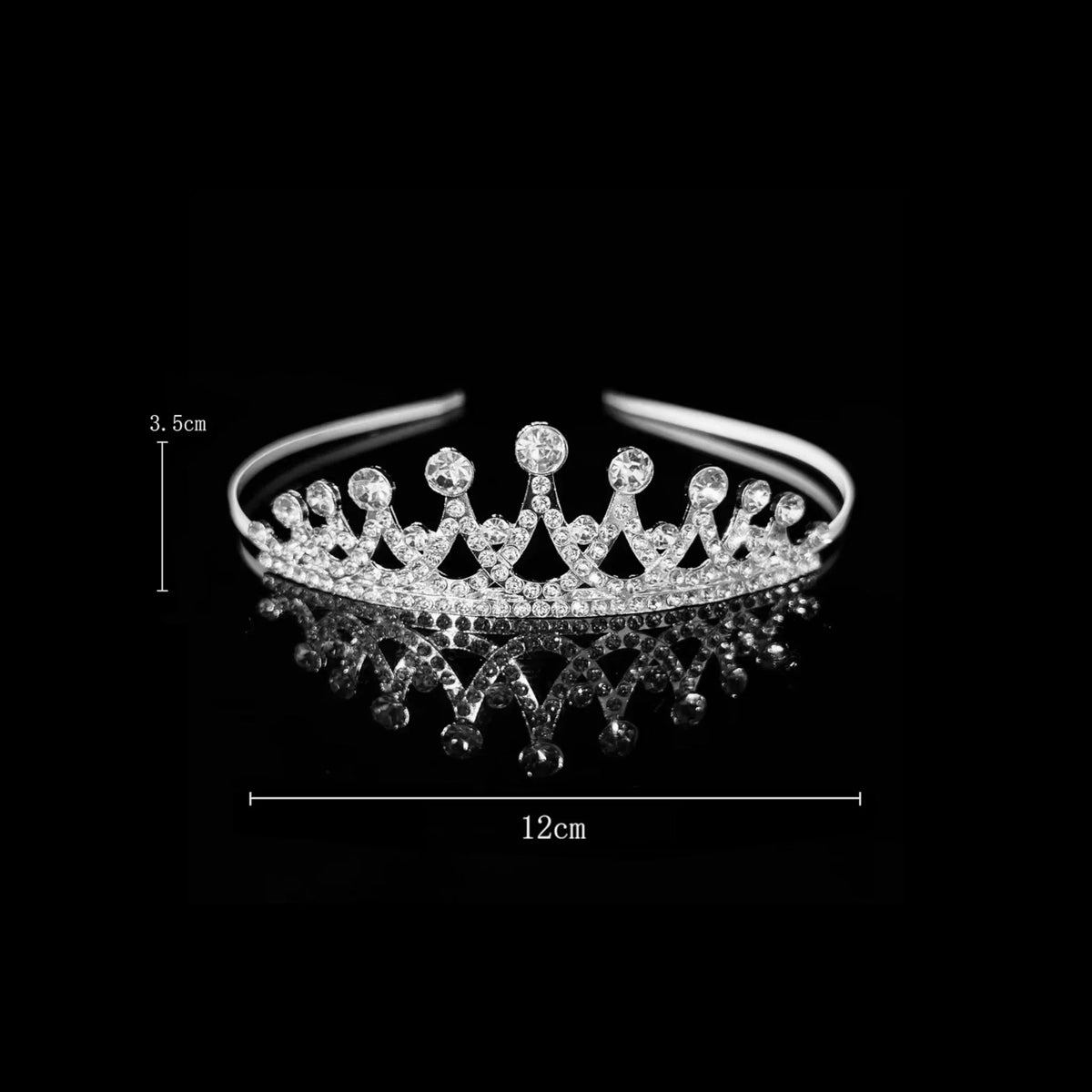 Silver classic crown tiara with upright pointed spikes tipped with round crystals — detail