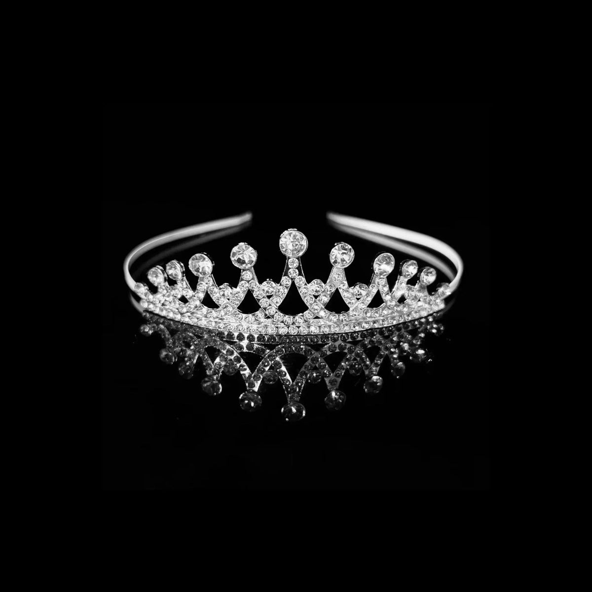 Silver classic crown tiara with upright pointed spikes tipped with round crystals