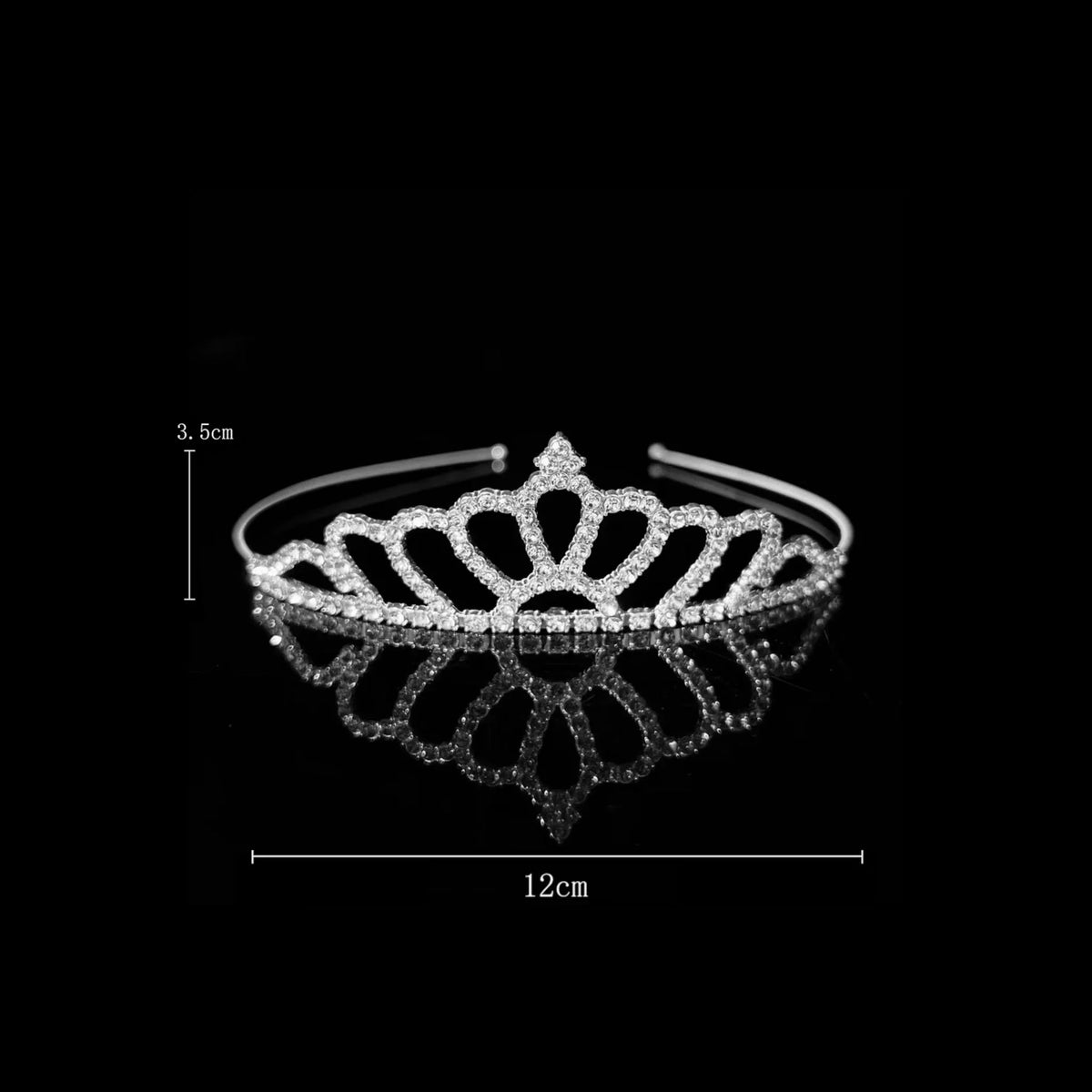 Silver tiara with large open teardrop loops fanning out from a pointed centre — detail