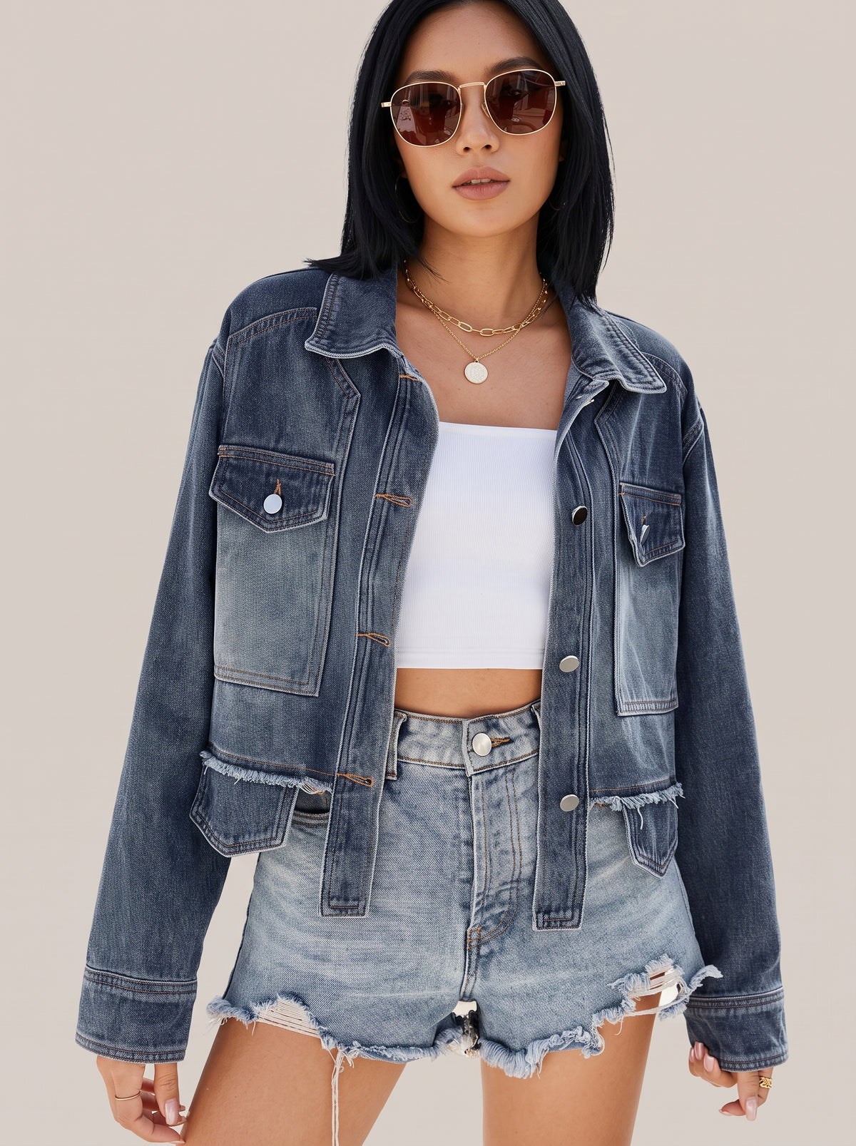 Navy button up denim jacket, front view with flap chest pockets and lower patch pockets
