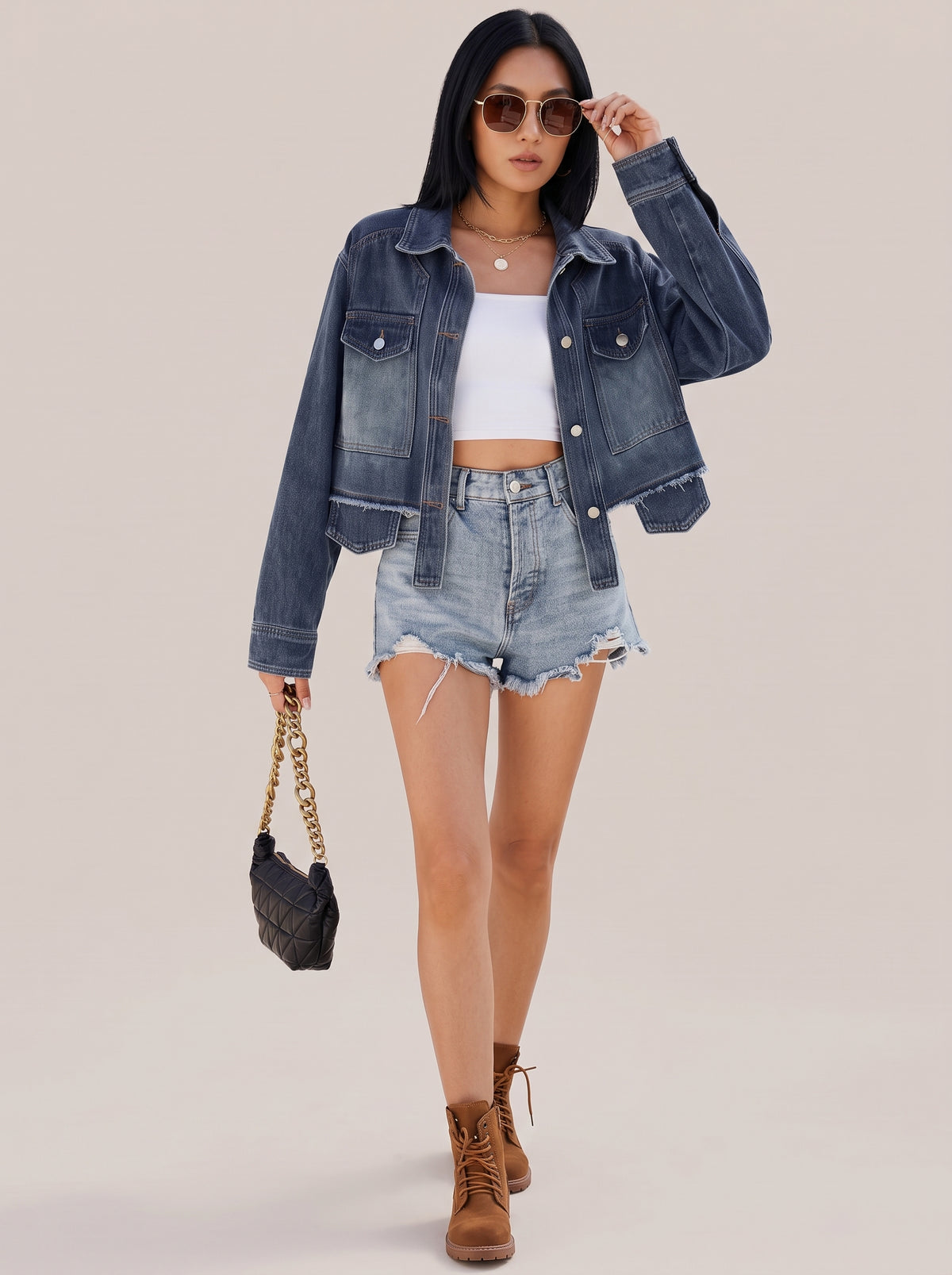 Navy button up denim jacket, full length view with a black pouch bag