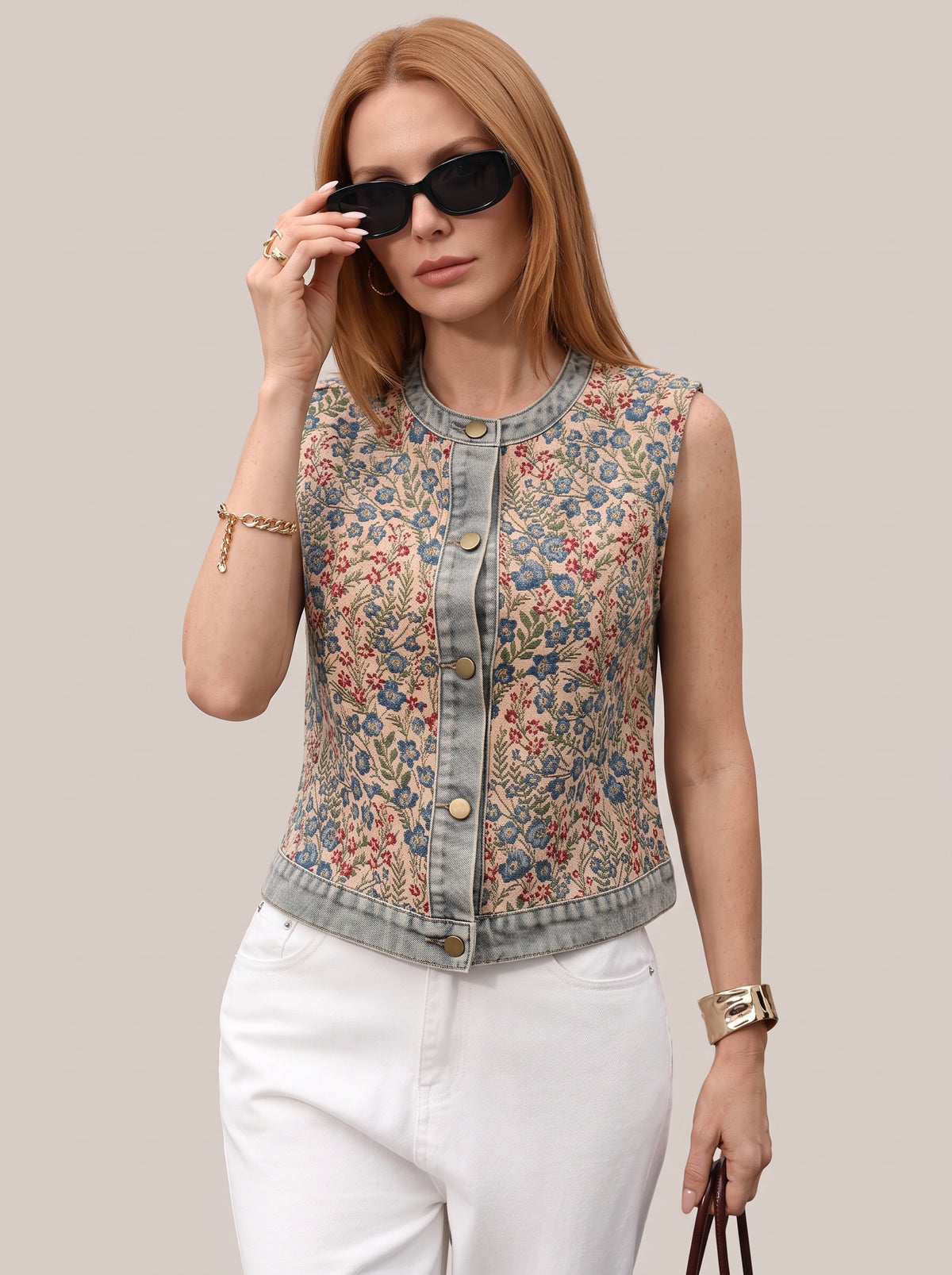 Floral vest top with light wash denim trim, worn buttoned, front view
