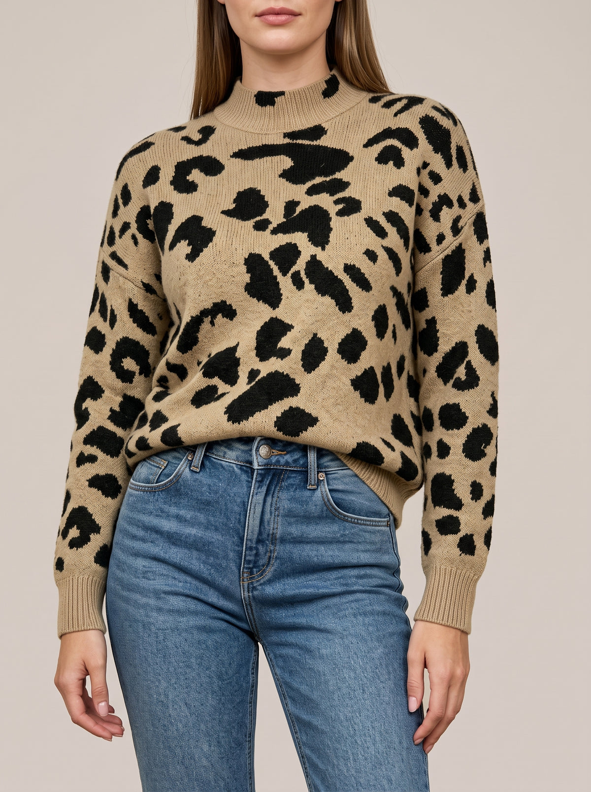 Khaki knit mock neck sweater with a black leopard-style spot pattern, dropped shoulders and ribbed cuffs, front view
