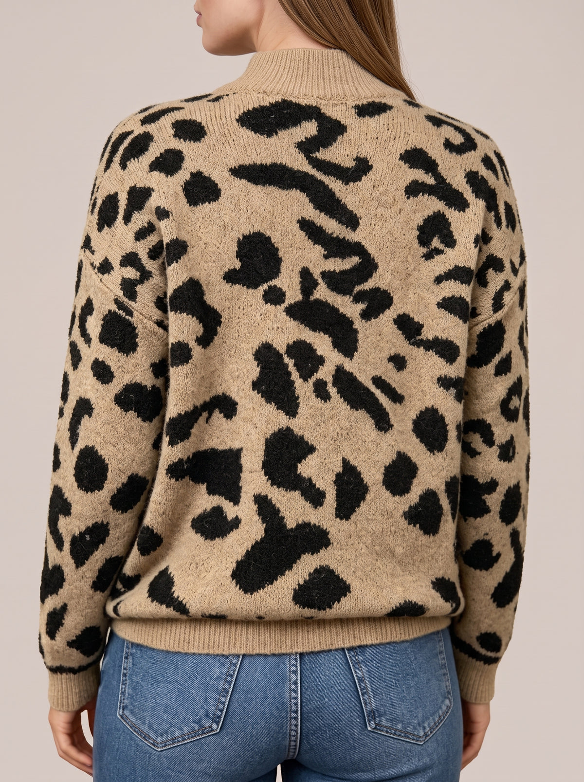 Back view of the khaki leopard print knit sweater with ribbed collar and ribbed hem