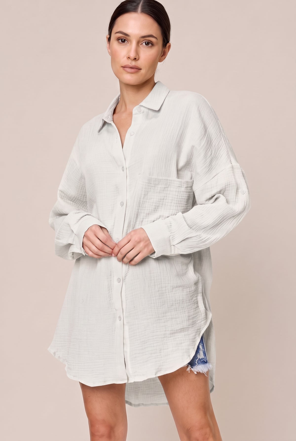 White long sleeve textured cotton button-up shirt with a chest pocket and buttoned cuffs, front view